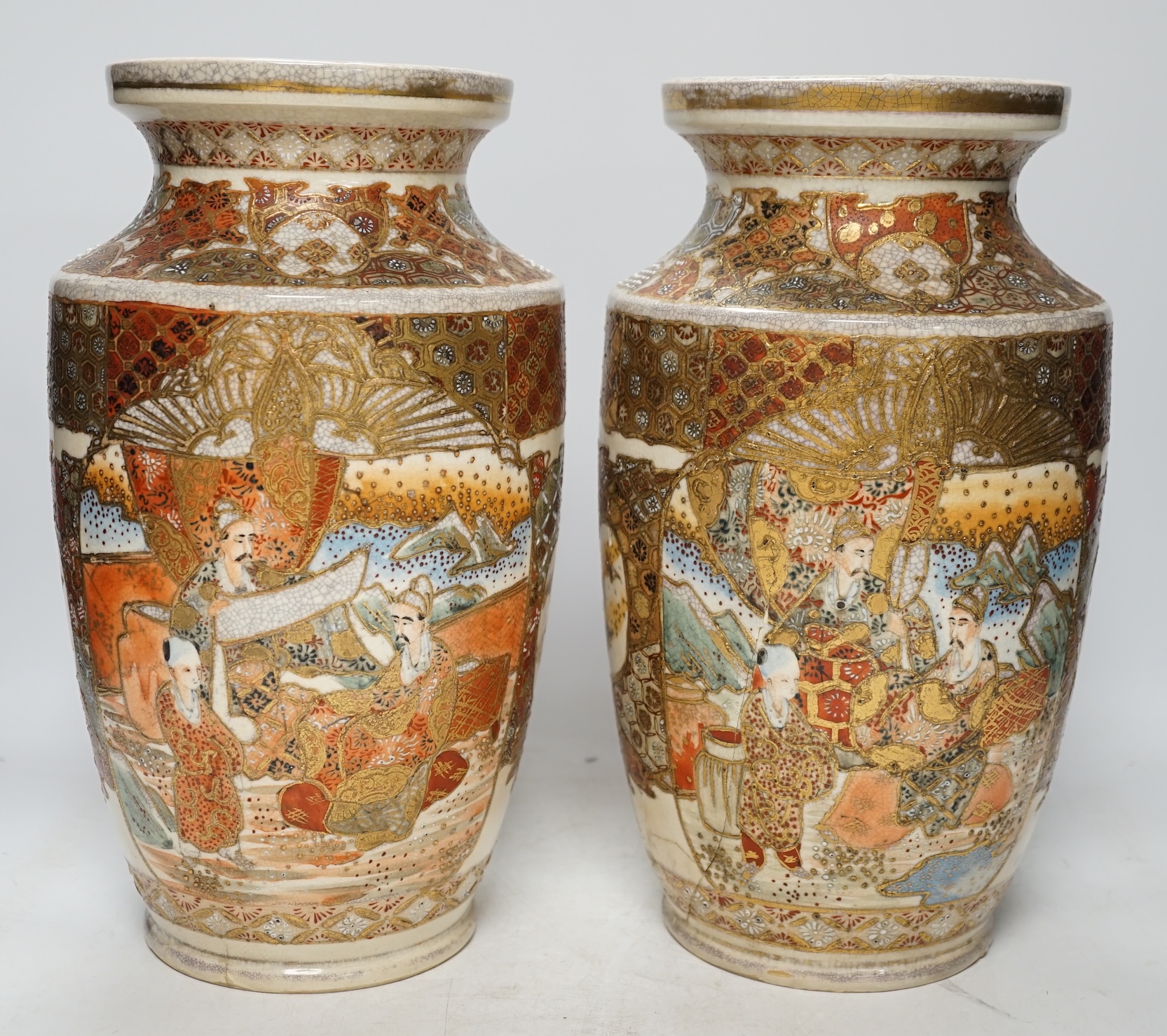 A pair of early 20th century Japanese Satsuma vases, 31cm high. Condition - poor, one repaired